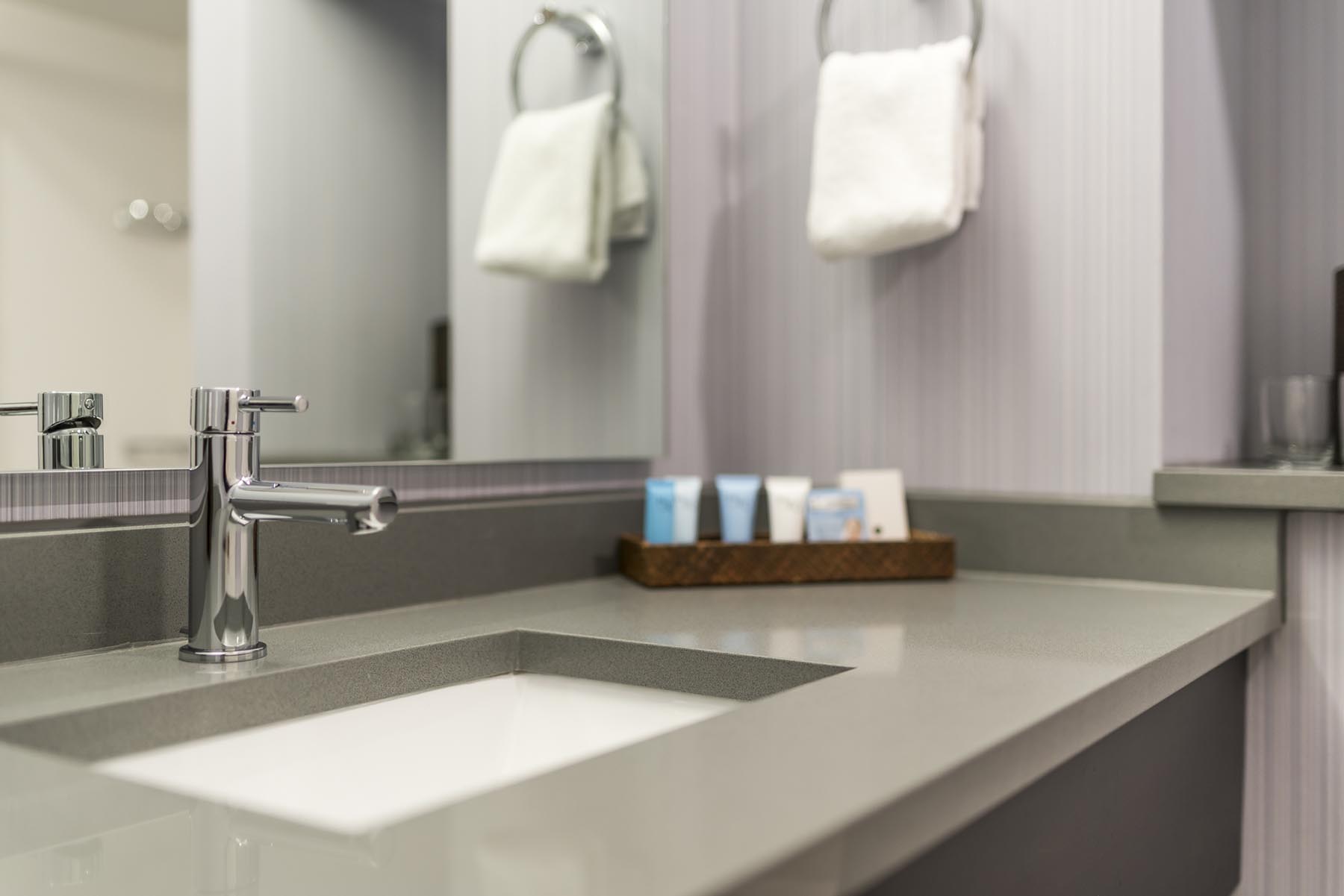 Bathroom Sink and Complimentary Products in Guest Room at Rockport Inn & Suites