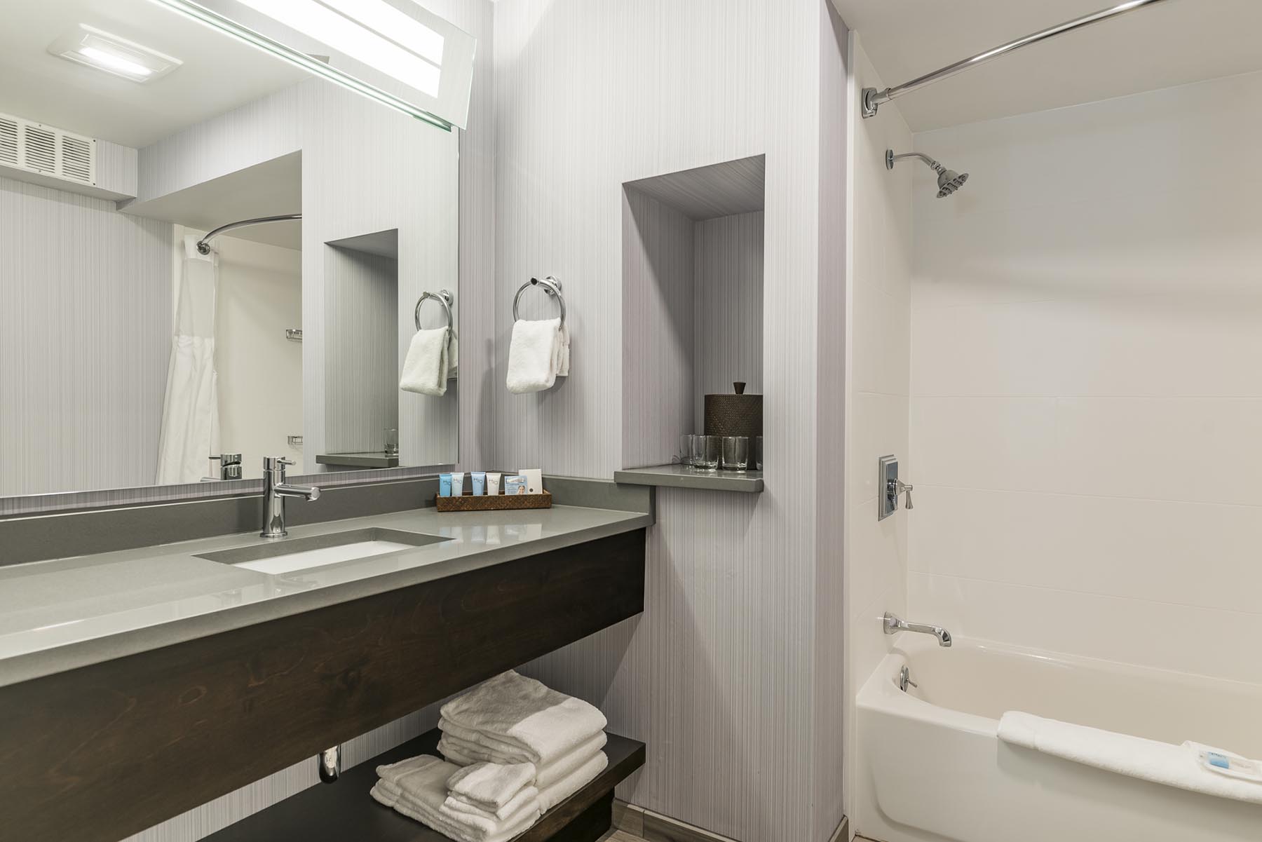 Guest Bathroom Sink, Mirror, Shower, Tub at Rockport Inn & Suites